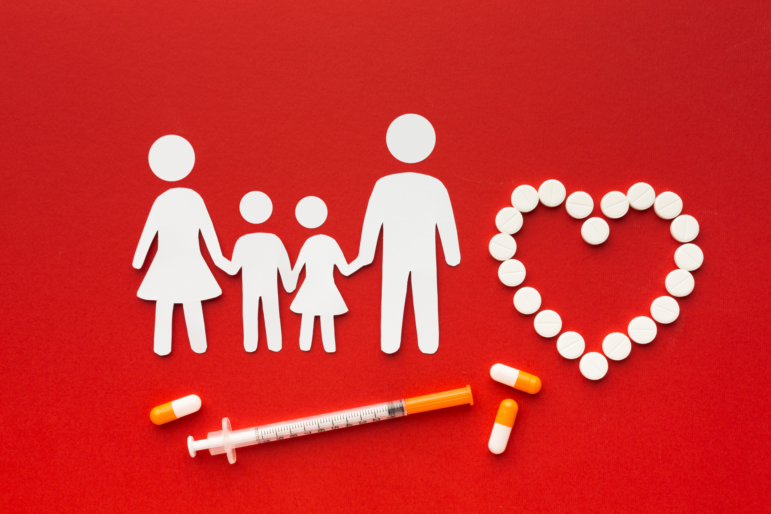 cardboard-family-shapes-with-drugs-syringe